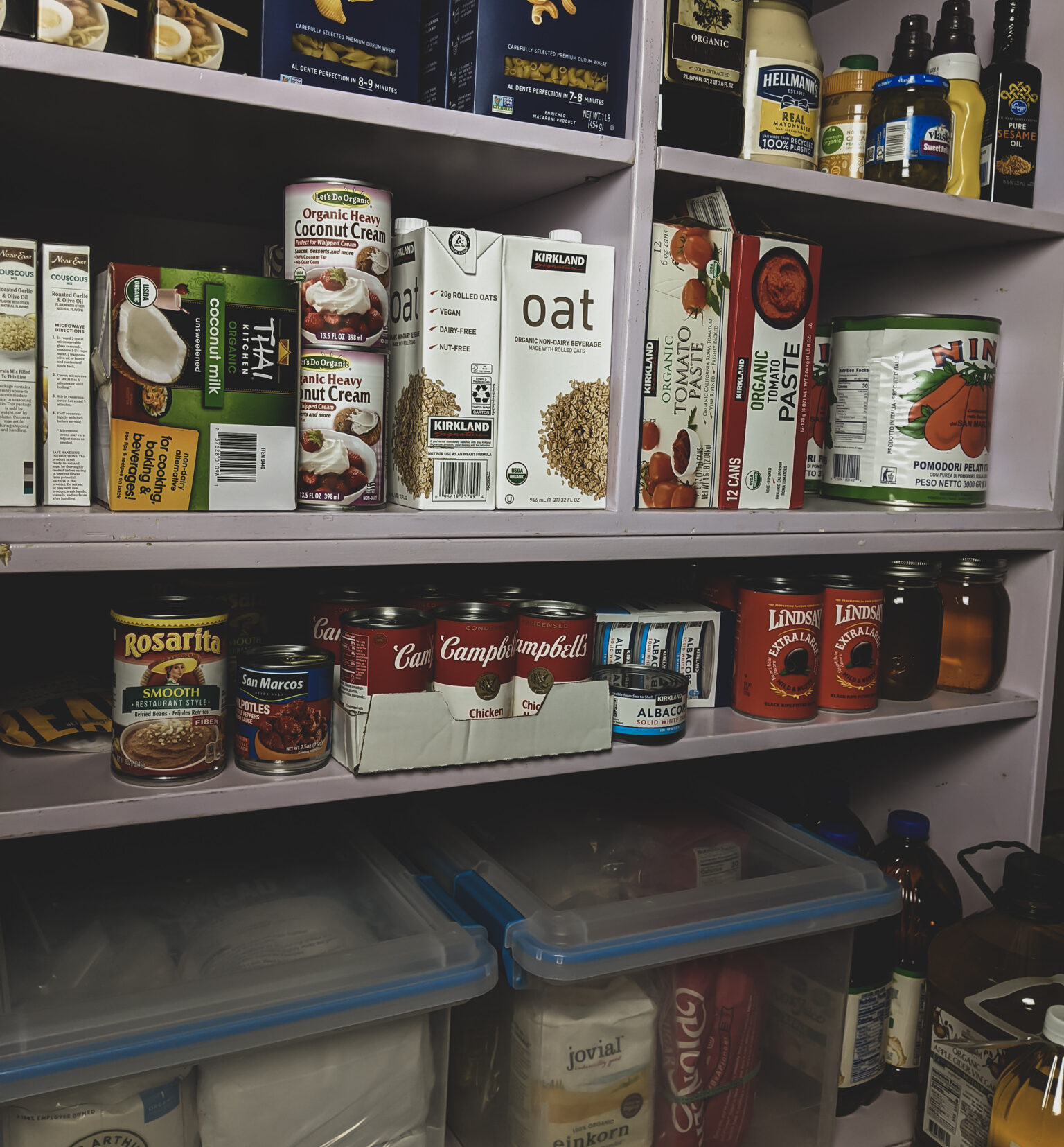 Pantry shelf full of groceries.